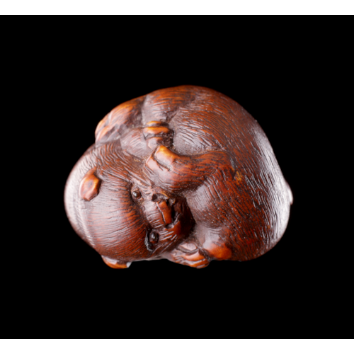 A Finely Carved Wood Netsuke of Two Puppy Dogs Playing